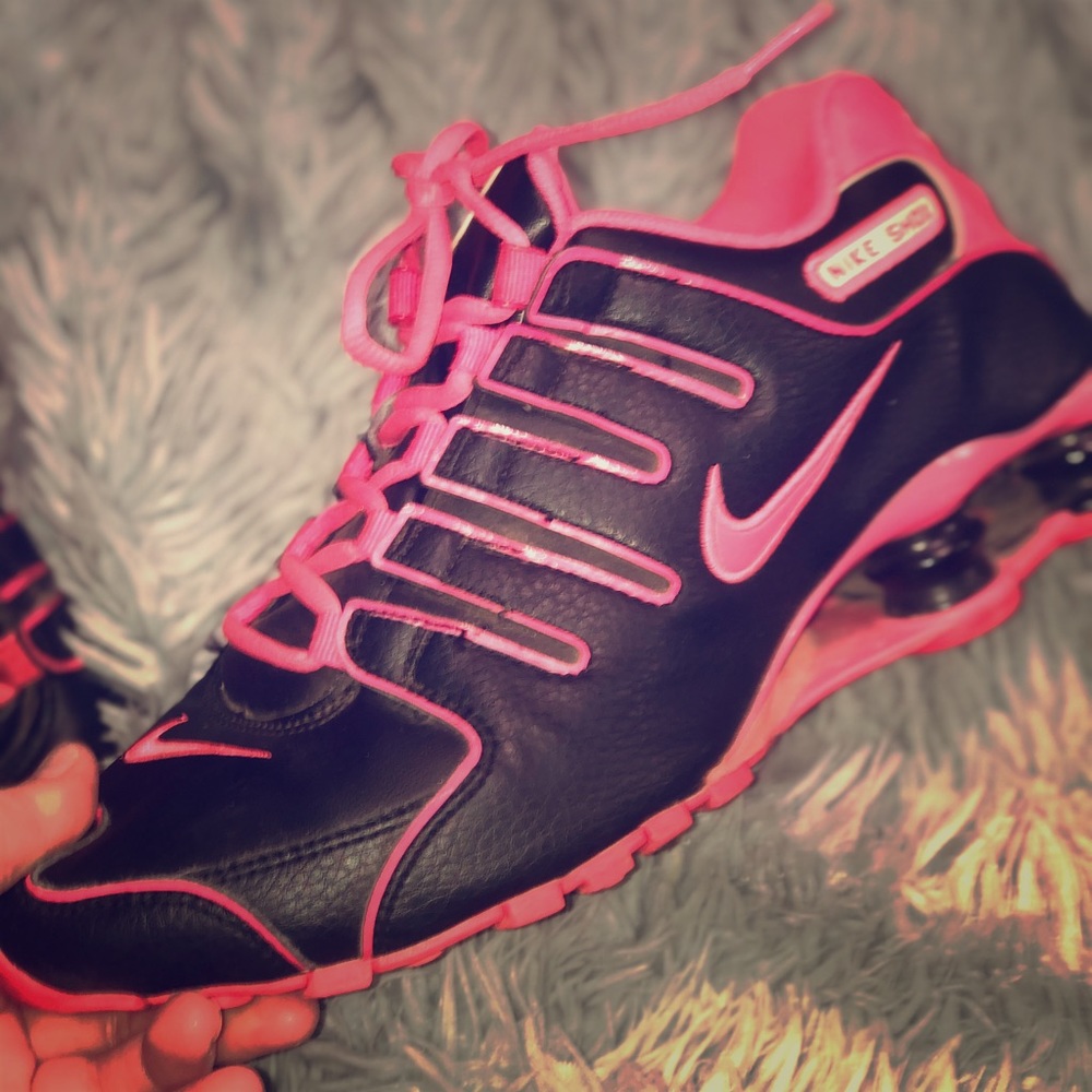 Pink and black nike shocks